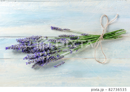 Lavender bouquet on a rustic wooden background, a bunch of lavandula plants 82736535