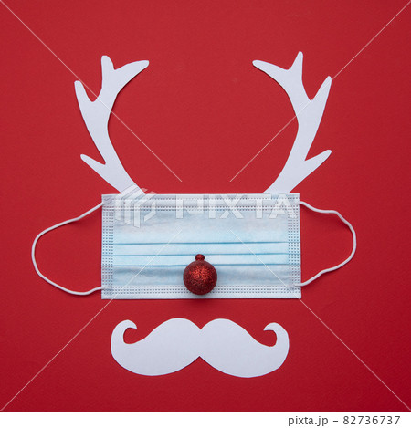 Festive christmas reindeer made from face mask and decorations Festive christmas reindeer made from face mask and decorations 82736737