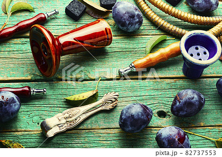 Arabic hookah with plum Arabic hookah with plum 82737553