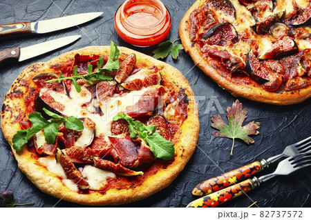 Pizza with meat and fruits Pizza with meat and fruits 82737572