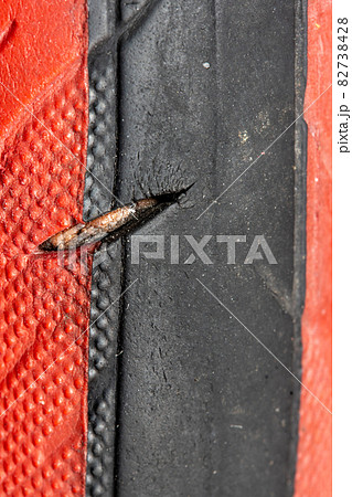 Torn bicycle tire, close up view. 82738428