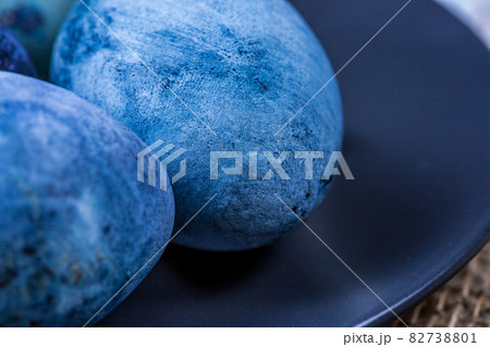 Close-up of blue easter eggs painted with natural dyes Close-up of blue easter eggs painted with natural dyes 82738801