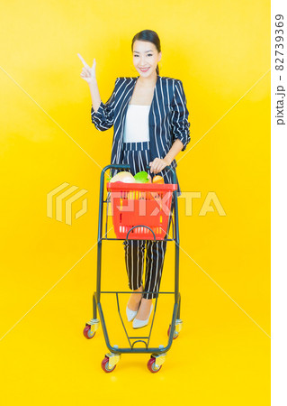 Portrait beautiful young asian woman smile with grocery basket 82739369