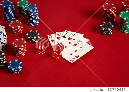 Poker cards and gambling chips on red background 82740455