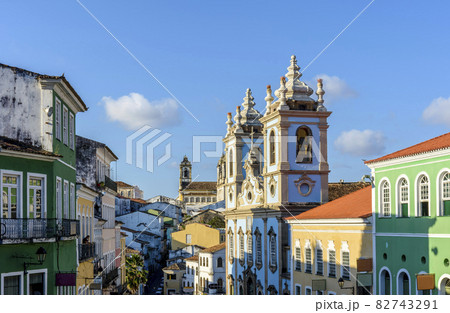 Old colorful houses facades and historic church towers in baroque and colonial style in Pelourinho, Salvador 82743291