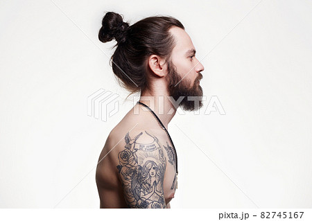 Handsome Bearded Man with long hair and tattoo 82745167