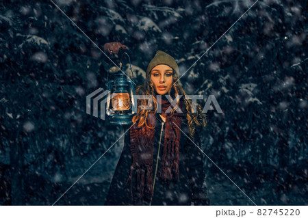 Young girl in winter forest fairy tale 82745220