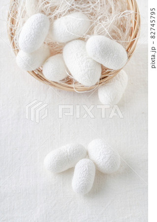 white silkworm cocoons shells, source of silk fabric in the basket 82745795