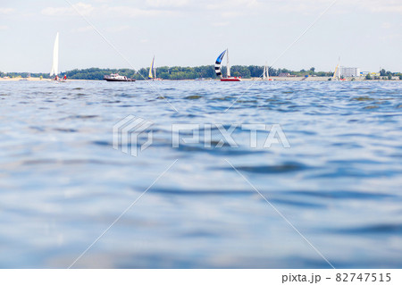 Competition among yachts with sails on the water of the Volga River Competition among yachts with sails on the water of the Volga River 82747515