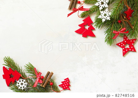 Christmas composition, winter, new year concept. Branches of spruce and red decorations. Top view flat lay. Free space for your text. Christmas composition, winter, new year concept. Branches of spruce and red decorations. Top view flat lay. Free space for your text. 82748516