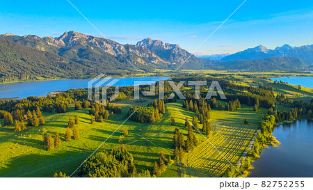 Aerial view over Lake Forggensee at the city of Fuessen in Germany  82752255