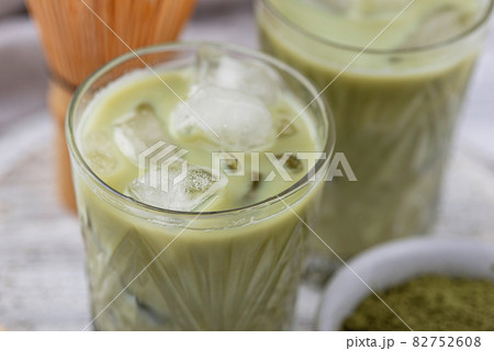 Cold matcha tea with milk and ice Cold matcha tea with milk and ice 82752608