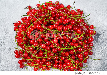 Nature Red currant berries on a kitchen table. White background. Top view Nature Red currant berries on a kitchen table. White background. Top view 82754282