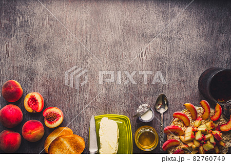Ingredients for oatmeal on dark wooden table. Concept of healthy food. Top view, copy space. Toned 82760749