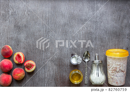 Ingredients for oatmeal on dark wooden table. Concept of healthy food. Top view, copy space. 82760759
