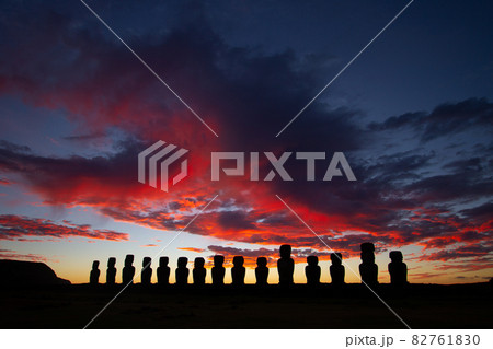 Dramatic colorful sunrise over Moai stone sculptures at Ahu Tongariki, Easter island, Chile. Dramatic colorful sunrise over Moai stone sculptures at Ahu Tongariki, Easter island, Chile. 82761830