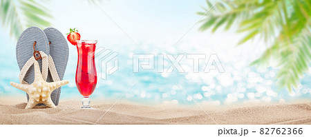 Fresh cold tropical cocktail, flip flops and starfish Fresh cold tropical cocktail, flip flops and starfish 82762366