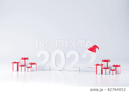 2022 font, Santa Claus hat and gift box At Christmas and New Year on a white background 2022 font, Santa Claus hat and gift box At Christmas and New Year on a white background 82764052
