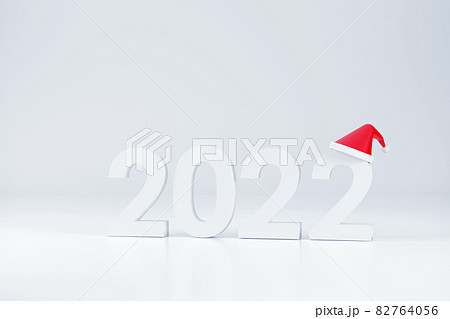 2022 font and Santa Claus hat At Christmas and New Year on a white background 2022 font and Santa Claus hat At Christmas and New Year on a white background 82764056