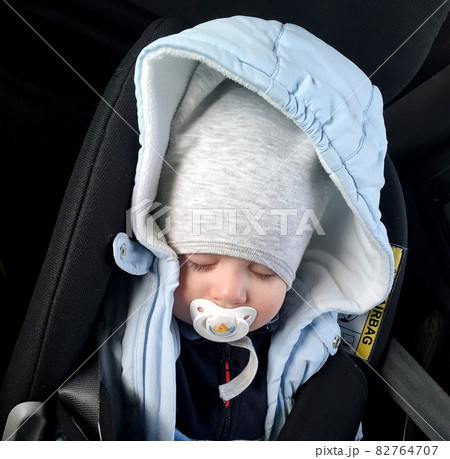 Sleeping baby boy with child pacifier posing photographer for color photo Sleeping baby boy with child pacifier posing photographer for color photo 82764707