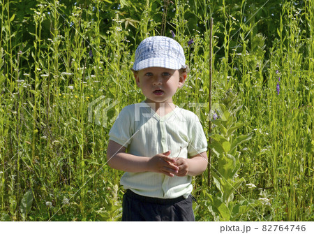 Beautiful baby boy with child face posing photographer Beautiful baby boy with child face posing photographer 82764746