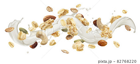 Granola with milk splash isolated on white background Granola with milk splash isolated on white background 82768220