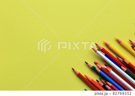 Colored pencils on a colored background. A set of pencils for drawing. Background from pencils. 82769352