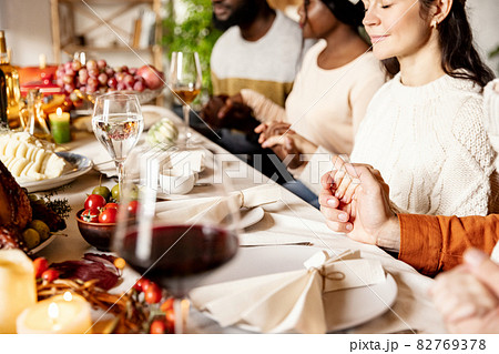 Happy family celebrate Thanksgiving day, sitting at table with roasted turkey and holiday traditional food, dishes. Happy family celebrate Thanksgiving day, sitting at table with roasted turkey and holiday traditional food, dishes. 82769378