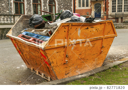 Skip container full of scrap waste household rubbish Skip container full of scrap waste household rubbish 82771820