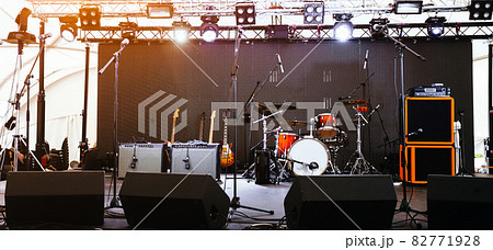 An empty Stage Before the Concert with floodlight, musical instruments 82771928