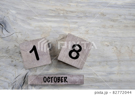 cube calendar for october on wooden background with copy space 82772044