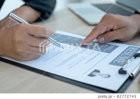 Business people hold a resume and talk to job applicants for job interviews about careers and Her personal history in the company. Recruitment concepts 82772743