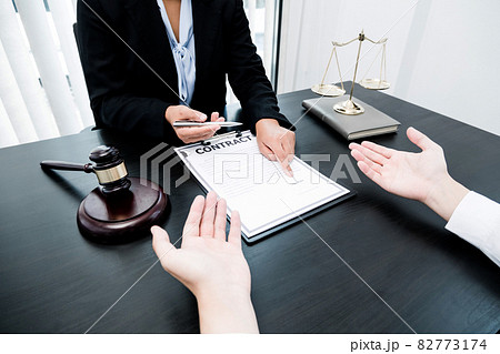 A woman lawyer or a judge counseling clients about judicial justice and prosecution with scales, judges gavel, legal documents legal services concept A woman lawyer or a judge counseling clients about judicial justice and prosecution with scales, judges gavel, legal documents legal services concept 82773174