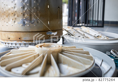 Dirt laundry tub full of mold,algae stains,preparing to clean and clear the washer drum,eliminate musty odors,stale smell,rust stains inside of machine for washing clothes at home,big cleaning concept 82775264