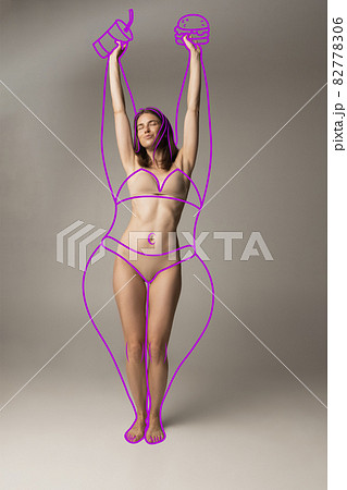 Artwork. Young beautiful woman with perfect body shape in lingerie, inner wear isolated over gray background. 82778306