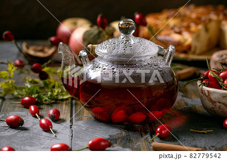 Rose hip berries herbal tea in glass teapot 82779542