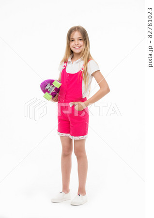 Small girl smile with skate board isolated on white. Child Small girl smile with skate board isolated on white. Child 82781023