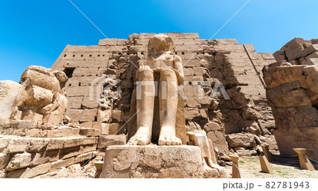 Feet of an ancient statue of Pharaoh in the Karnak temple in Luxor 82781943