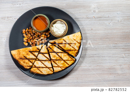 view of served Quesadilla on plate with copyspace 82782552