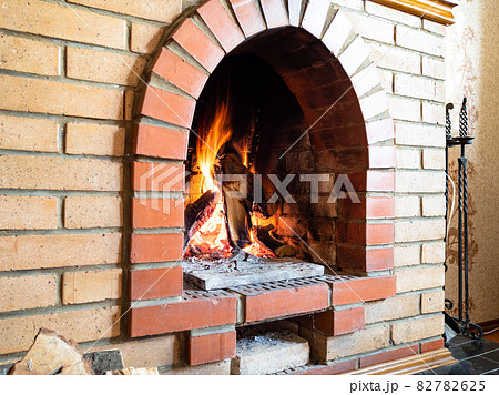 brick fireplace with mantelpiece in country house 82782625