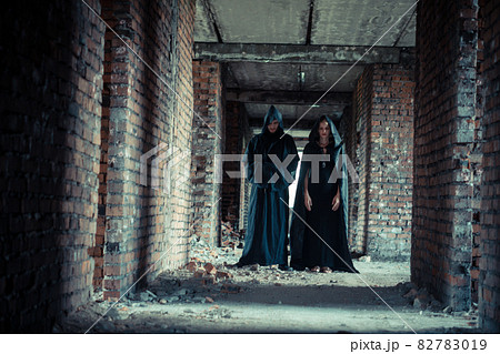 a man and a woman in black raincoats 82783019