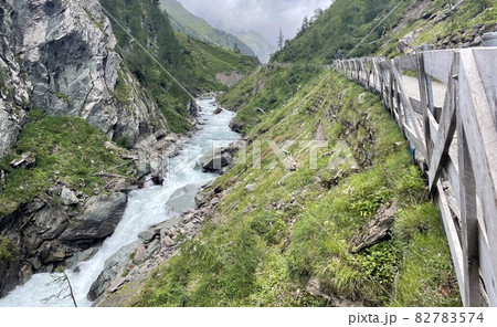 wanderpath in the rocks near a wild river 82783574