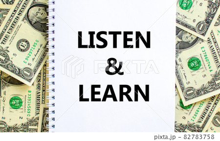 Listen and learn symbol. Words 'Listen and learn' on white note. Beautiful background from dollar bills. Business, educational and listen and learn concept. Copy space. Listen and learn symbol. Words 'Listen and learn' on white note. Beautiful background from dollar bills. Business, educational and listen and learn concept. Copy space. 82783758