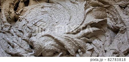 Gypsum plaster in a bucket, prepared for application on the wall. Beautiful texture. 82783818