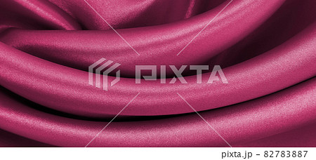Smooth elegant pink silk or satin luxury cloth texture as abstract background. Luxurious background design Smooth elegant pink silk or satin luxury cloth texture as abstract background. Luxurious background design 82783887