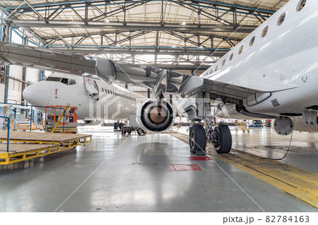 Panoramic view of aerospace hangar with planes Panoramic view of aerospace hangar with planes 82784163