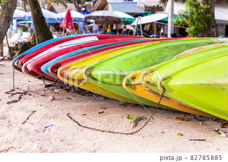kayak multicolored on the background of a sandy beach of a tropical island kayak multicolored on the background of a sandy beach of a tropical island 82785885