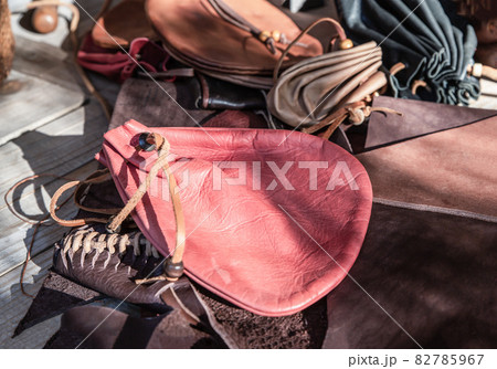 red leather bag for storing gold and precious stones close up 82785967