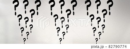 Multiple black question marks against a white office building background, abstract text concept 82790774