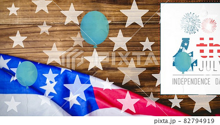 Composition of 4th of july text, blue balloons and stars over american flag Composition of 4th of july text, blue balloons and stars over american flag 82794919